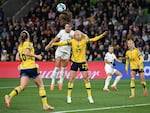 USA forward Alex Morgan (C) heads the ball next to Sweden's defender Amanda Ilestedt in the 89th minute of their Women's World Cup matchup on August 6, 2023.