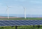 FILE: Solar panels and wind turbines work to create clean electric power, at Wheatridge Renewable Energy Facility, May 24, 2022.