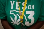 A Trulieve employee wears a T-shirt in support of Amendment 3 in Florida, a ballot initiative which would have legalized the recreational use of pot in the state for adults 21 years old and older.