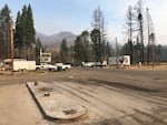 Blue River in late August, nearly a year after the Holiday Farm Fire hit the region on Labor Day, 2020.  Many structures — including a gas station, general store, and garage — were reduced to rubble.