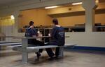 FILE - In this March 18, 2011, unidentified inmates play cards in the Josephine County Jail in Grants Pass, Ore. The Oregon Health Authority wants to provide full Oregon Health Plan coverage for adults in county jails.