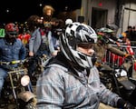 Costumed racers line up in the pits at the One Moto at Veterans Memorial Coliseum in Portland, Ore.