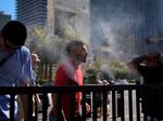 People cool off in misters along the Las Vegas Strip during a deadly, record-breaking heatwave. Heatwaves are growing in intensity, frequency and duration as climate change intensifies. 