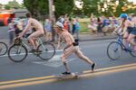 A skateboarding sailor joins the ride.