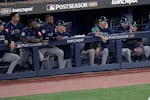The Seattle Mariners watch from their dugout during the ninth inning in Game 7 of baseball's American League Championship Series against the Toronto Blue Jays, Monday, Oct. 20, 2025, in Toronto.