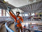 FILE: Syhean Osby of Northwest Scaffold Service Inc. erects scaffolding in the council chambers on May 15, 2024. Construction was underway at Portland City Hall to accommodate the expanded 12-person council, as approved by voters in 2022.