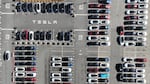 Brand-new Tesla cars sit in a parking lot at the Tesla factory in Fremont, Calif., in October. Tesla stock lost 65% of its value in 2022.