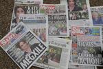Newspapers are placed on the ground by a television crew in front of Buckingham Palace in London, Monday, March 8, 2021. Britain's royal family is absorbing the tremors from a sensational television interview by Prince Harry and the Duchess of Sussex, in which the couple said they encountered racist attitudes and a lack of support that drove Meghan to thoughts of suicide.