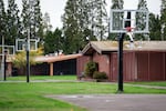 Basketball courts stand outside of detainee residences at MacLaren Youth Correctional facility in Woodburn, Ore., on Nov. 6, 2025.