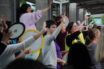 Guynes and Earl Boyles' teachers and staff wave goodbye to students on the last day of school.