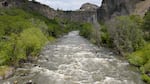 Aerial stills capture a group of kayakers as they attempt a source-to-sea journey along the Klamath River. Kayakers encounter winding river bends, rock formations and rapids.