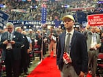 Jacob Daniels, Oregon campaign director for Donald Trump, stands among the state delegation on the floor of the Republican National Convention.