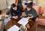 Lewis & Clark graduate students Jordan Stokes, left, and Kathryn Nock, right, give feedback on classmates’ lesson plans. Stokes and Nock were part of a group of future social studies and science teachers wrapping up a lesson on place-based learning.