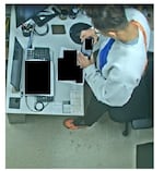 Stills from surveillance video that show Sgt. Jian Zhao, a battery supply officer at Washington’s Joint Base Lewis-McChord, taking photos.