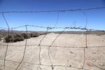 A barbed wire fence blocks access to one of the roads built by Jindalee Resources, an Australia-based mining company that has applied to do exploratory drilling for lithium in the McDermitt Caldera in Southeast Oregon near the Nevada state line. Photograph taken April 4, 2025.