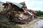 A damaged home is seen after flash flooding in Hunt, Texas, on July 5, 2025. Rescuers were on Saturday searching for more than 20 girls missing from a riverside summer camp in the US state of Texas, after torrential rains caused devastating flooding that killed at least 27 people -- with more rain on the way. "So far, we've evacuated over 850 uninjured people, eight injured people and have recovered 27 deceased fatalities at this time. Of these 27, 18 are adults, nine are children," said Kerr Country Sheriff Larry Leitha on July 5. (Photo by RONALDO SCHEMIDT / AFP) (Photo by RONALDO SCHEMIDT/AFP via Getty Images)
