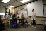 Class of 2025 student Raiden presents his research into black panthers, as his teacher, Angie Swanson offers encouragement.