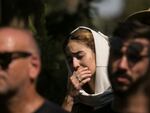 Family and friends of May Naim, 24, who was killed by Palestinian militants at the "Supernova" festival, near the Israeli border with Gaza strip, react during her funeral on Oct. 11, 2023 in Gan Haim, Israel.