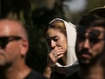 Family and friends of May Naim, 24, who was killed by Palestinian militants at the "Supernova" festival, near the Israeli border with Gaza strip, react during her funeral on Oct. 11, 2023 in Gan Haim, Israel.