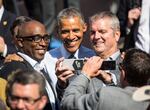 President Barack Obama takes a selfie with community members after discussing the Trans-Pacific partnership agreement at Nike's world headquarters on May 8, 2015.