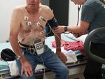 A nurse checks a patient’s pulse following a cardiac stress test during a special monthly visit by a cardiology team to Douglas County Memorial Hospital in Armour on May 30.