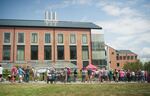 People wait in line to see the corpse flower Titan VanCoug on the Washington State University campus in Vancouver, Wash., Tuesday, July 16, 2019.