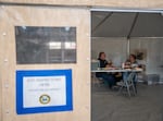 Oregon Department of Forestry ground support unit leader Les Hannah, left, talks with ODF team two logistics section chief Dawn Sleight in the inspections tent, where all vehicle records and inspection information are kept and managed.