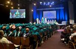 FILE - Graduates of the Metro East Web Academy listen to a student speaker at graduation June 13, 2024.