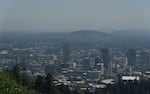 Visible smog blankets Portland, Ore., on July 26, 2022. The city broke an all-time heat record for the date when the temperature hit 102 degrees.