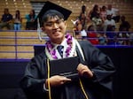 Class of 2025 student Austin N. walks off the stage at graduation from Adrienne C. Nelson High School on June 9, 2025.