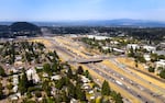 The first toll could go into effect as early as next year on Interstate 205, shown here in this July 2022 file photo, near Oregon City, and city officials there fear already congested streets will get worse as drivers leave the freeway for other routes.