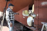 Fisherman Bob Kemp inspects his hull before heading out fishing, April 30, 2025. He has a dedicated loading zone where he can load up his boat when he’s heading out on a two-week albacore trip. But tourists and locals often ignore the signs.