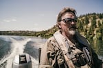 Transportation Coordinator Mike Kjolso drives a boat on Lake Spokane during production of “Z Nation.”