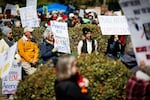 People listens as speakers address the gathered comity for the third No Kings rally on Saturday, March 28, 2026 in Richmond, Virginia.