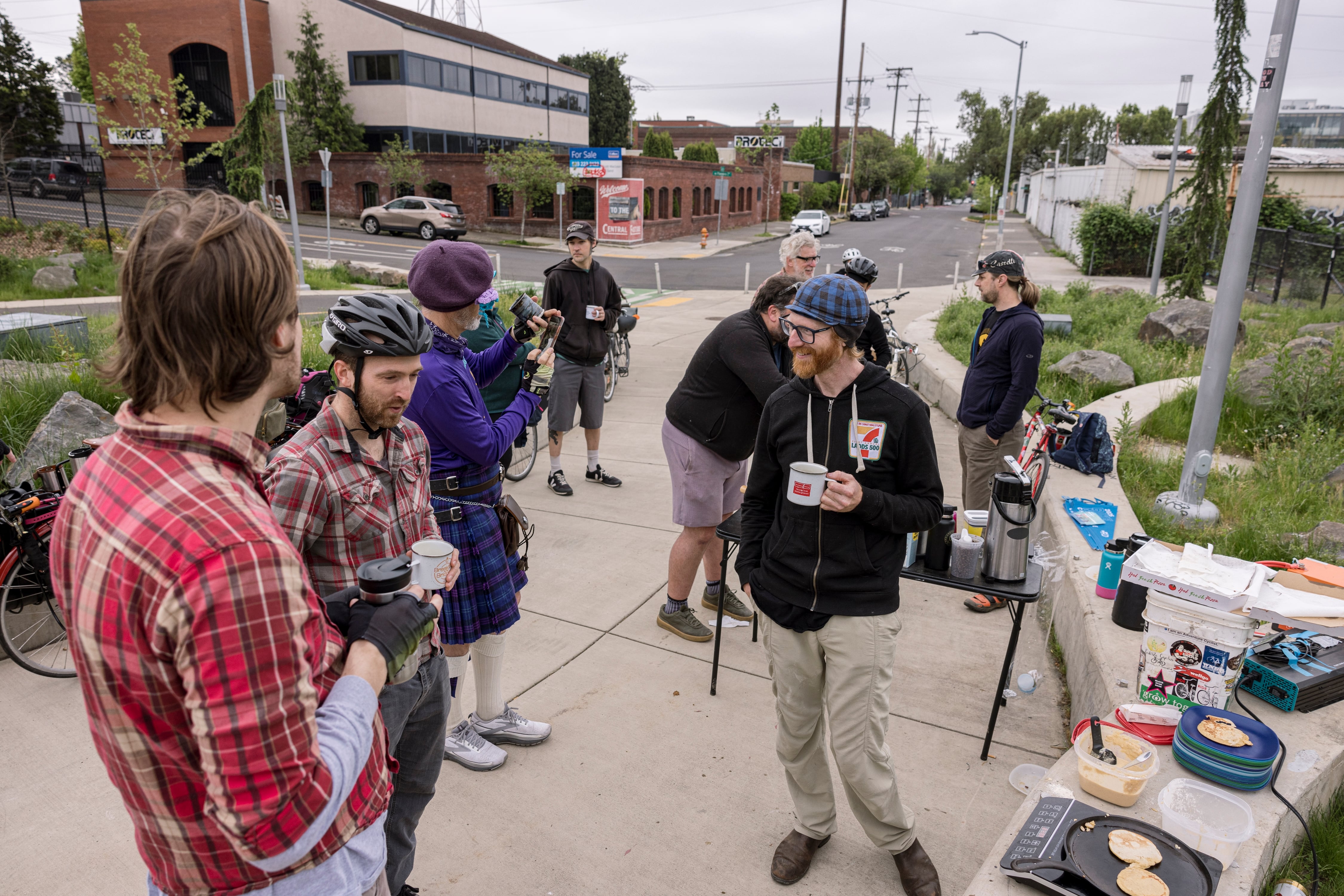 Lance Poehler (blue cap), is one of the organizers for the Blumenauer Bridge breakfast. While coffee and breakfast are appreciated, many stop for the community.