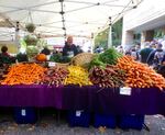 Psychedelic Minestrone With Arugula Pesto calls for purple and yellow carrots like these from DeNoble Farms of Tillamook at the Portland Farmers Market in the South Park Blocks.