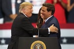 Then-President Donald Trump greets then-Florida Republican gubernatorial candidate Ron DeSantis during a campaign rally at the Hertz Arena on Oct. 31, 2018 in Estero, Fla. In 2024, the two candidates may run against one another for president.