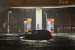 A vehicle is stranded on a water-flooded street after Hurricane Milton made landfall in Brandon, Florida on Oct. 9, 2024.