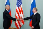 In this March 10, 2011, file photo, Vice President of the United States Joe Biden, left, shakes hands with Russian Prime Minister Vladimir Putin in Moscow, Russia. Putin won’t congratulate President-elect Joe Biden until legal challenges to the U.S. election are resolved and the result is official, the Kremlin announced Monday, Nov. 9, 2020.