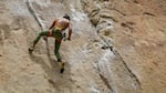 A rock climber climbs Smith Rock on May 16, 2020. It was the first weekend that Smith Rock State Park was open since the pandemic shut down parks in Oregon. 