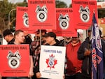 Teamsters Canada Rail Conference members picket outside the CPKC headquarters in Calgary, Alta., on Friday.