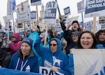 Despite the pouring rain, hundreds of people attended Portland Association of Teachers rally held at Roosevelt High School in Portland, Ore., Nov. 1, 2023. 