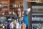 Kala Brooks is the bar manager of Top of the Monk, a craft cocktail bar in downtown Asheville. She hopes fall tourists will help boost business.