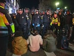 Boston police move to arrest pro-Palestinian supporters who were blocking the road after the clearing of Emerson College's encampment early Thursday morning.