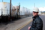 Alan Sprott, Vigor’s vice president of environmental affairs, in front of the company's oily wastewater treatment area. Vigor voluntarily shut down its treatment of third-party wastewater, which generated $1 million in annual revenue, because of neighbor complaints about the odor.