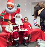 "I get two minutes with a kid to just have full attention on them," says "Black Santa PDX," center, who dresses up as Santa Claus meeting with more than 1,600 kids each winter.