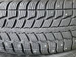 A close-up of the tread of a studded tire.