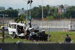 An NTSB investigator works near a damaged van at the site where an Amazon cargo plane overshot the runway two days earlier while landing at Miami International Airport, Tuesday, Sept. 8, 2026, in Miami.