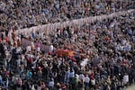 The body of Pope Francis is carried through St. Peter's Square to St. Peter's Basilica at the Vatican on Wednesday.