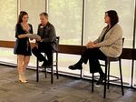 At a student town hall on June 3, 2026, SOU sophomore Tyler Penney shows President Rick Bailey and Provost Casey Shillam her suggestions for restructuring the university's academic programs.